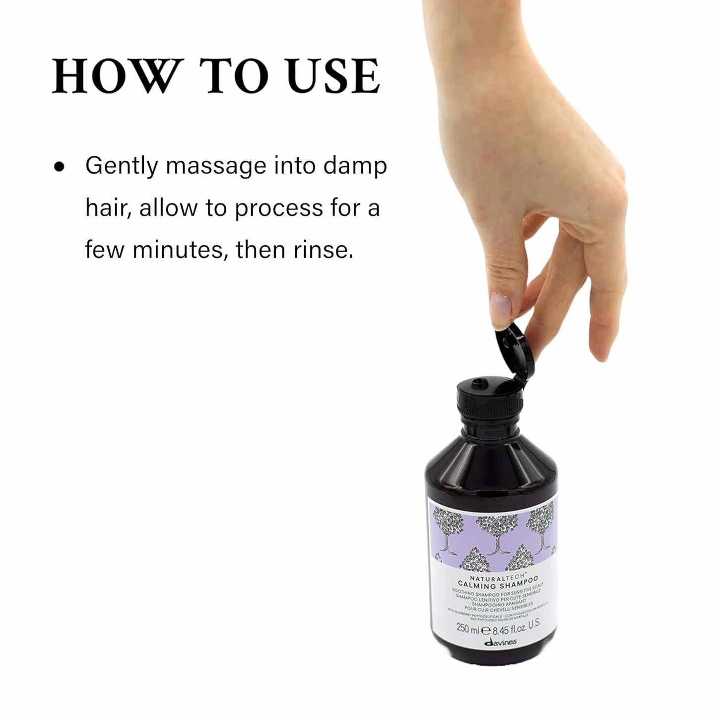 Davines Naturaltech Calming Shampoo - How To Use. Hand holding a bottle of Davines shampoo with usage instructions on a white background