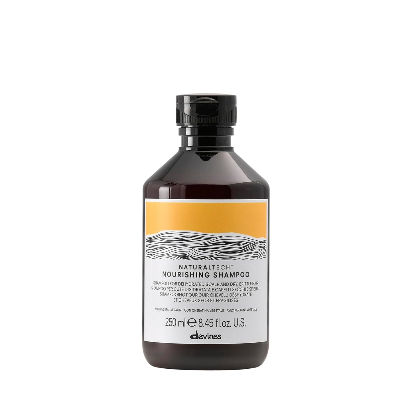 Davines Naturaltech Nourishing Shampoo. Bottle of Davines shampoo with a yellow label on a white background