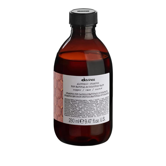 Davines Alchemic Shampoo Copper. Brown bottle with black cap and label on a white background