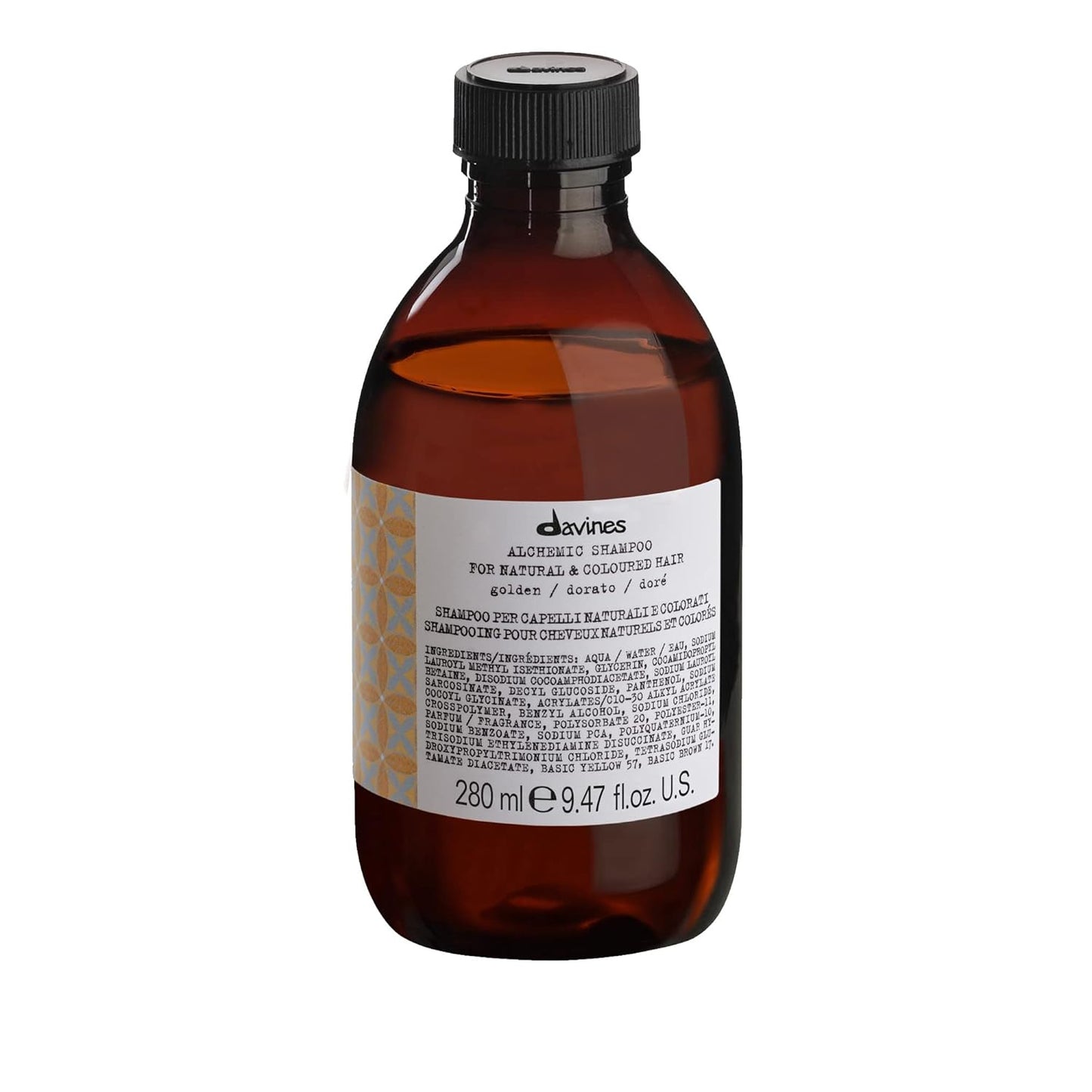 Davines Alchemic Shampoo Golden. Brown shampoo bottle with black cap and label on a white background