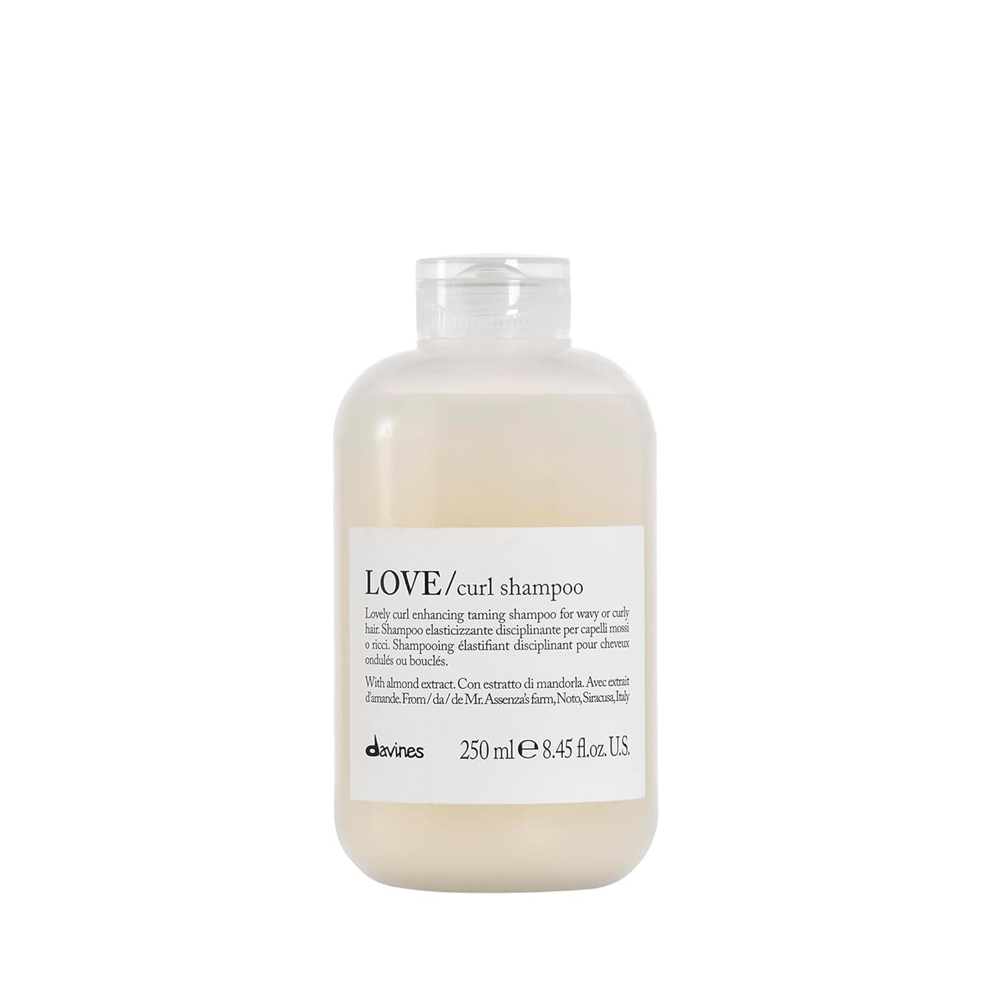Bottle of Davines LOVE/curl shampoo on a white background