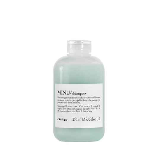 Bottle of Davines Minu shampoo on a white background