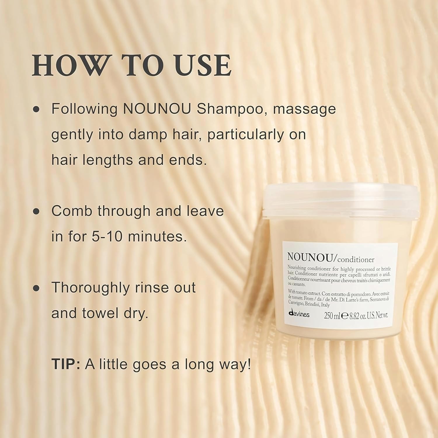 Davines NOUNOU conditioner jar with usage instructions on a wooden background