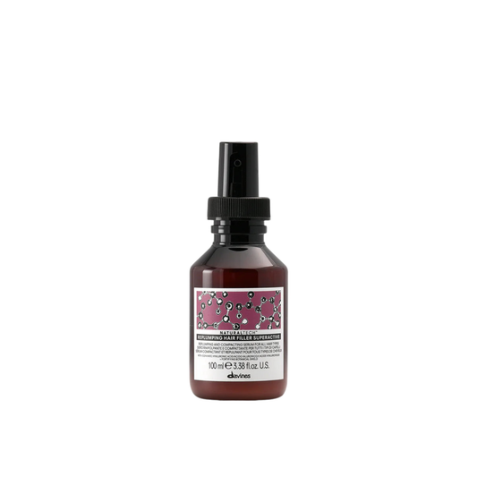 Davines Naturaltech Replumping Hair Filler Superactive. Bottle of Davines hair product on a white background