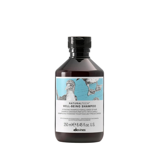 Bottle of Davines Naturaltech Well-Being Shampoo with a decorative label on a white background