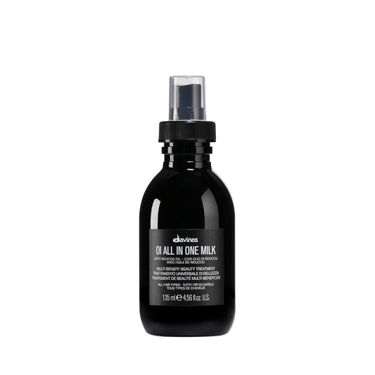 Davines OI All In One Milk. Black bottle of Davines hair product on a white background