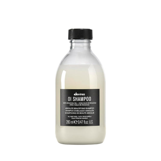 Bottle of Davines OI Shampoo on a white background