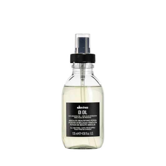 Bottle of Davines Oi Oil on a white background