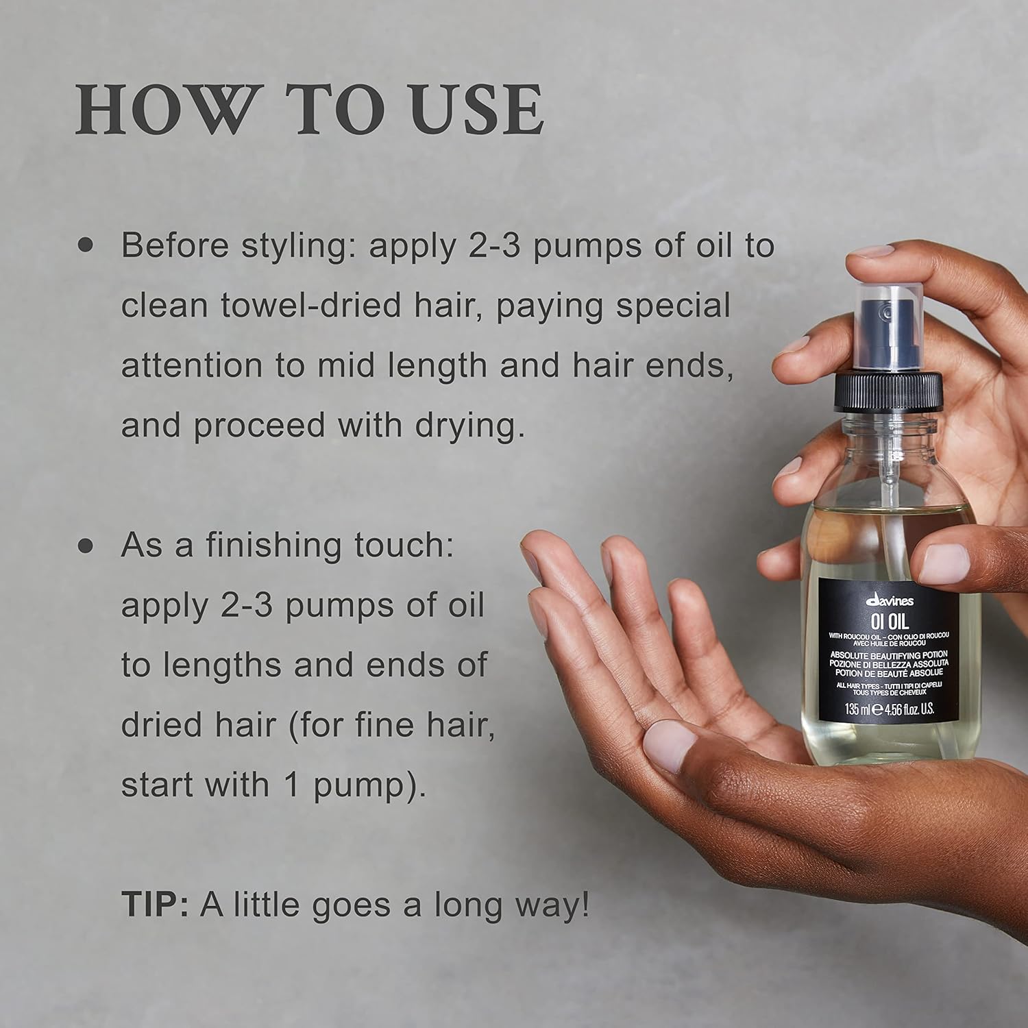 Davines Oi Oil. Hair oil bottle with usage instructions on a gray background