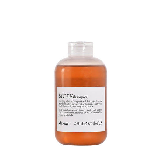 Shampoo bottle labeled 'SOLU/shampoo' by davines on a white background