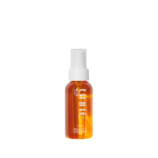 Unite U Oil. Orange bottle with white cap on a white background